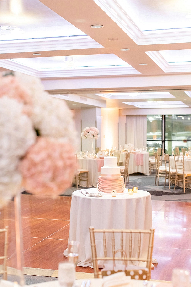 pink and white cake at pittsburgh hotel wedding
