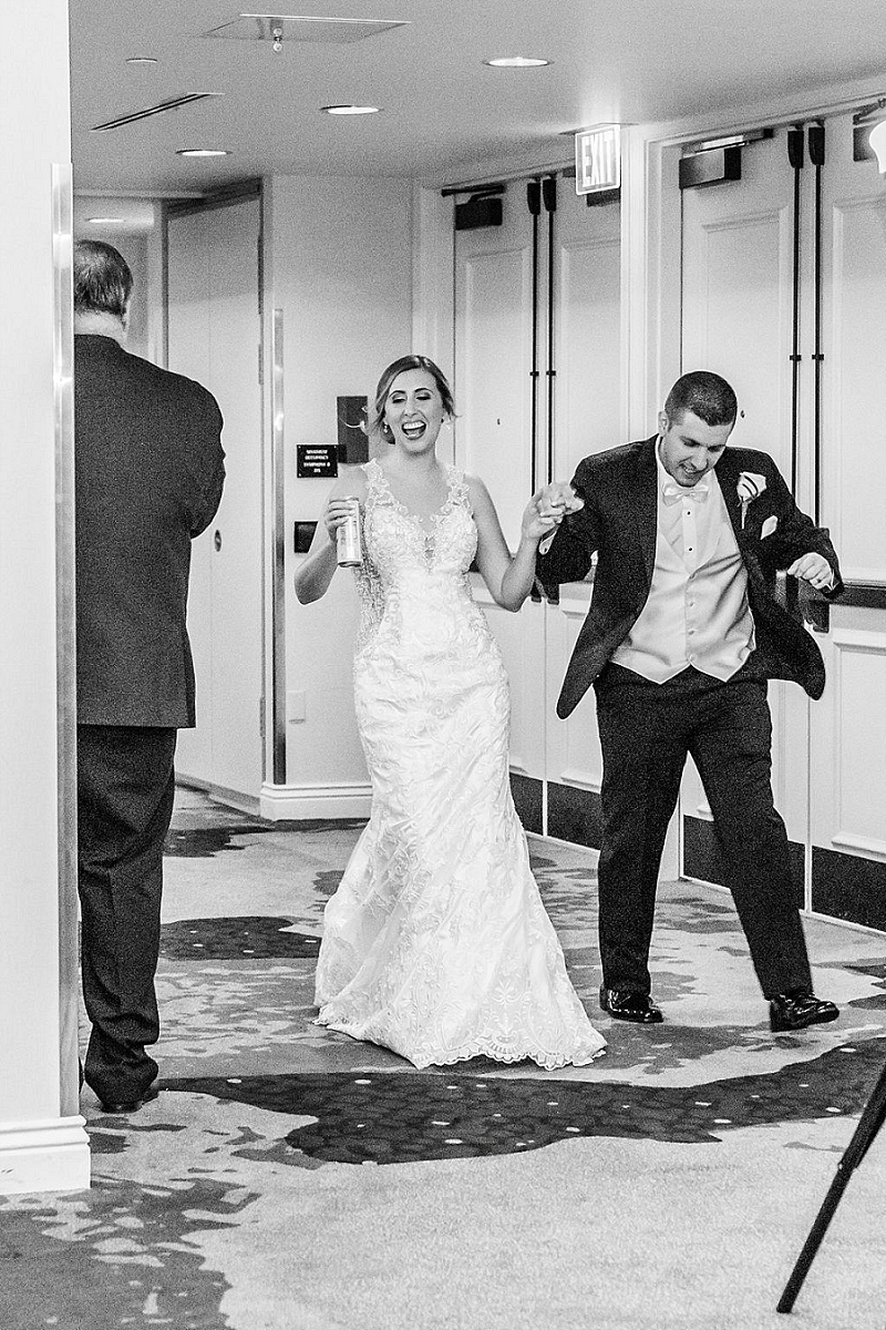 bride and groom enter reception at pittsburgh hotel wedding